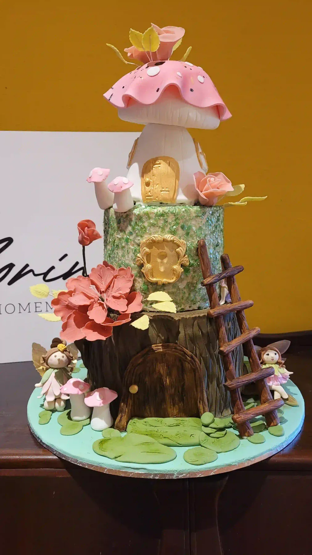 Fairytale mushroom cake with flowers, fairies and woodland details