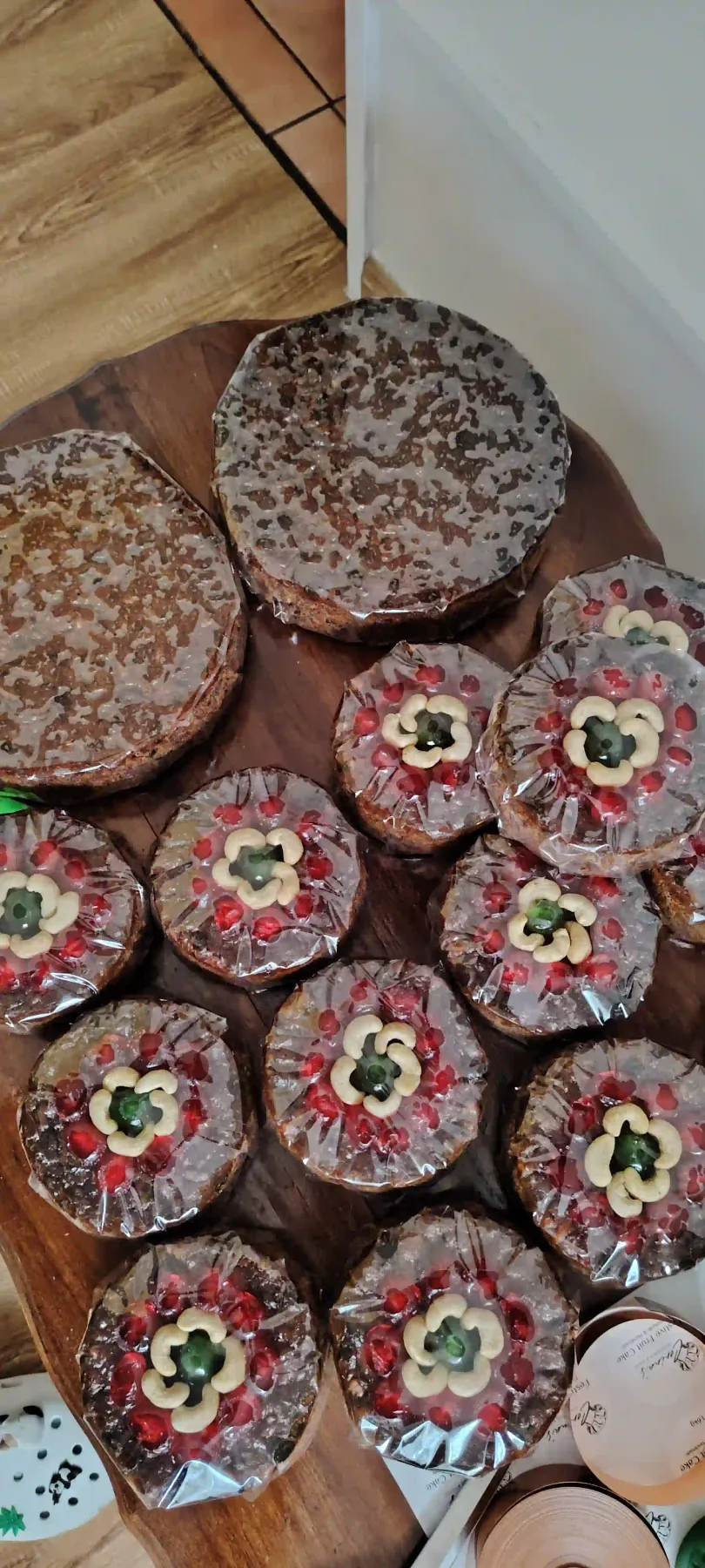 A selection of handmade festive fruit cakes with decorative toppings